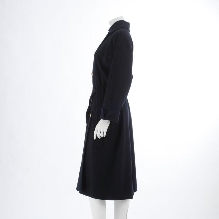 CÉLINE, a dark blue cashmere and wool coat.