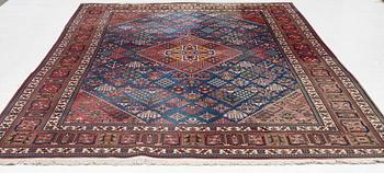 An oriental carpet, c. 360 x 240 cm.