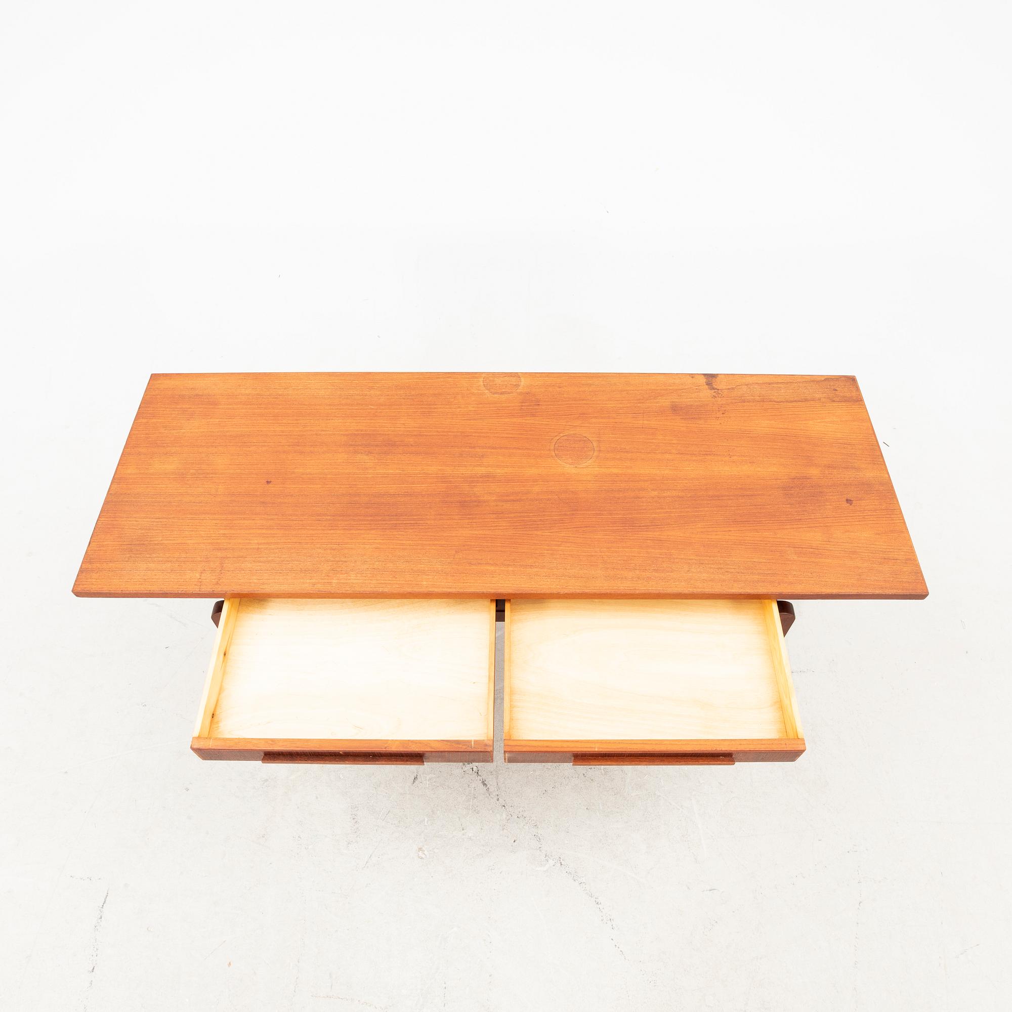 A teak coffee table from the middle of the 20th century.