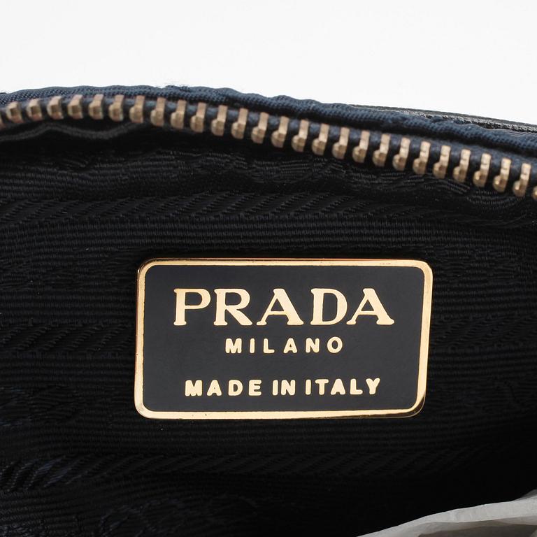 PRADA, a blue quilted fabric waiste bag and key holder.