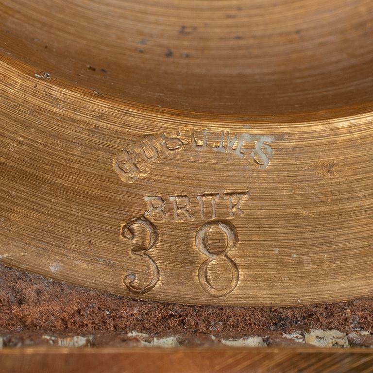 A pair of model 38 brass candlesticks from Gusums Bruk, first half of the 20th century.