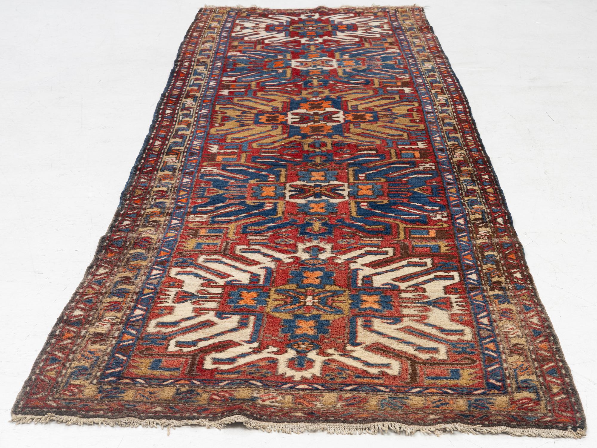 A runner carpet, North Western Iran, c. 317 x 107 cm.