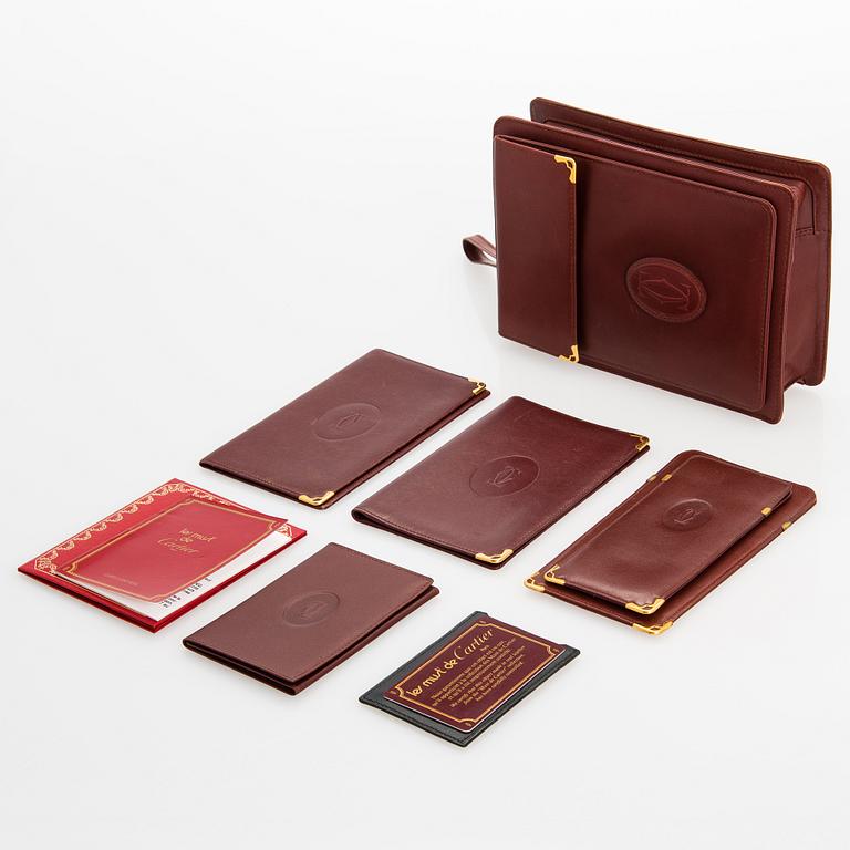 Must de Cartier bag clutch with accessories.