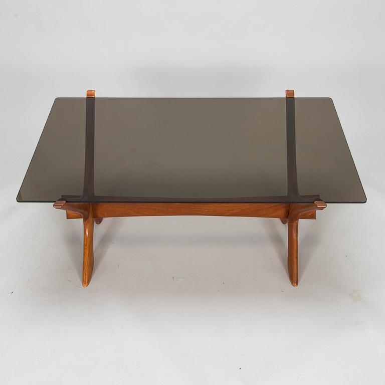 A coffee table in wood and glass, 1960s-1970s.