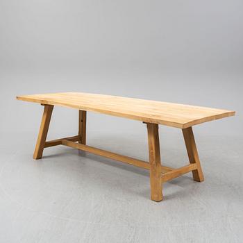 A contemporary oak table and two benches from Garbo Interiors.