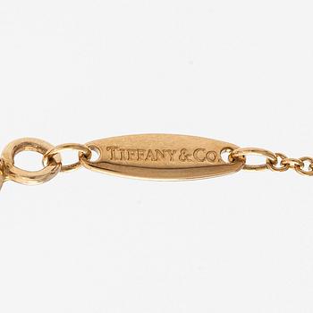 Tiffany & Co, Elsa Peretti, collier, 18K guld med en briljantslipad diamant ca 0.05 ct.