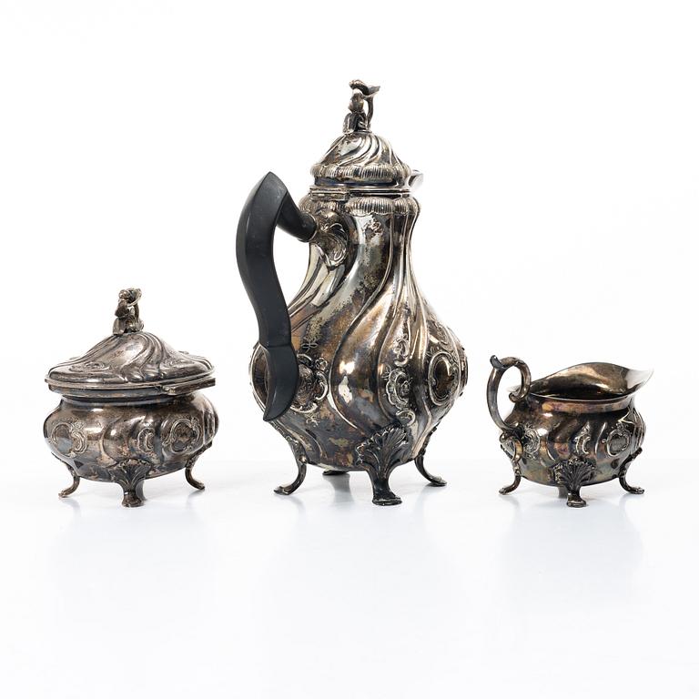 C.G. Hallberg, A three piece Roccoco style silver coffee service, Stockholm 1946.