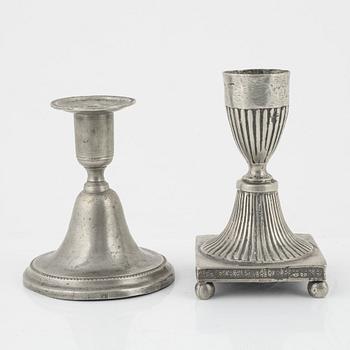 A group of three pewter candlesticks, a salt cellar and four dishes, including Erik Wikgren, Nyköping, (1805-1846).