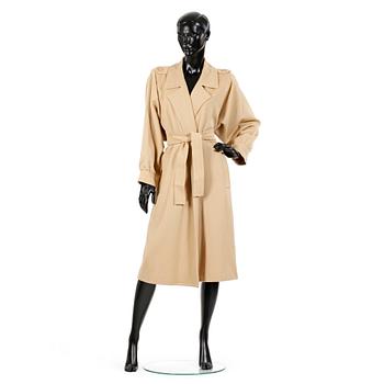 YVES SAINT LAURENT, a beige wool coat.