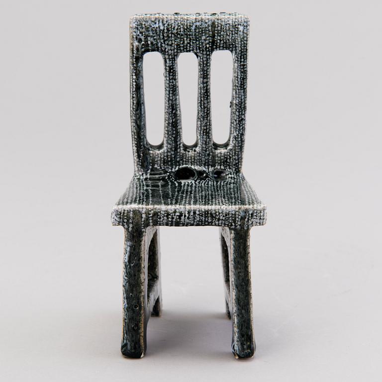 HEINI RIITAHUHTA, a porcelain miniature sculpture 'Chair' signed Heini Riitahuhta.