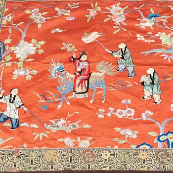 A Chinese silk embroidery, early 20th Century, a chinese blue and white placque, Ming dynasty (1368-1644).