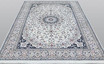 A Nain carpet, part silk, so called 6LAA, approximately 279 x 200 cm.