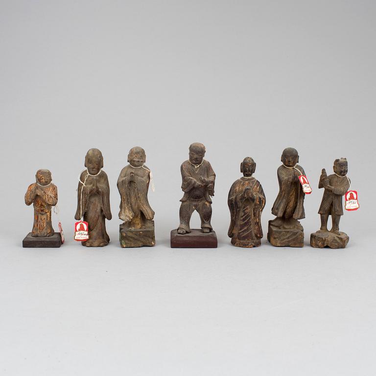 A group of seven wooden figurines, Ming dynasty and later.