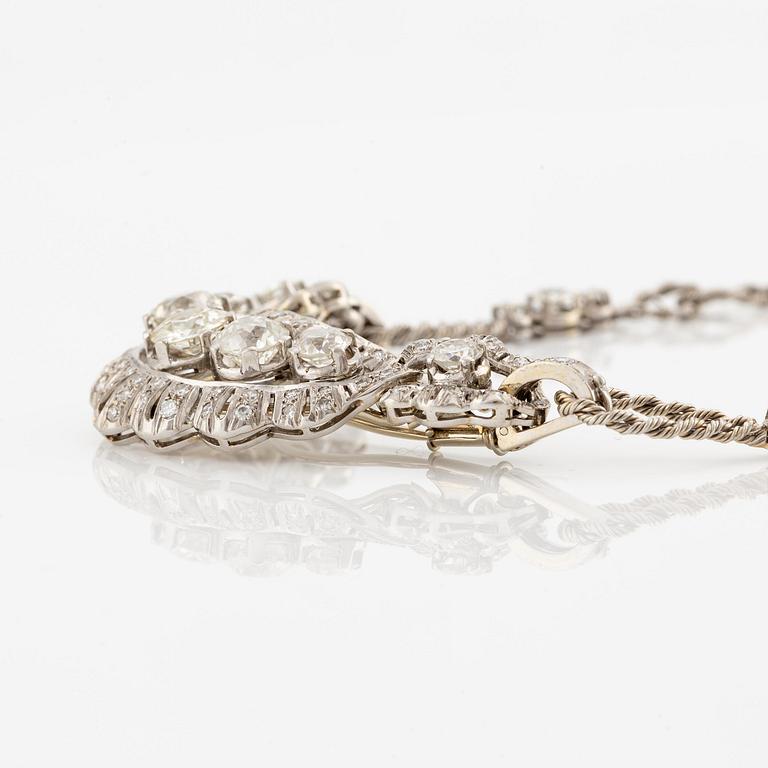 A brooch/necklace combination in 18K white gold set with old- and eight-cut diamonds.