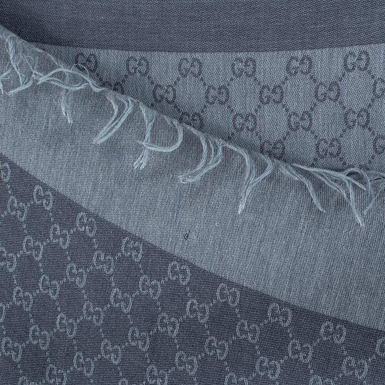 A shawl by Gucci.