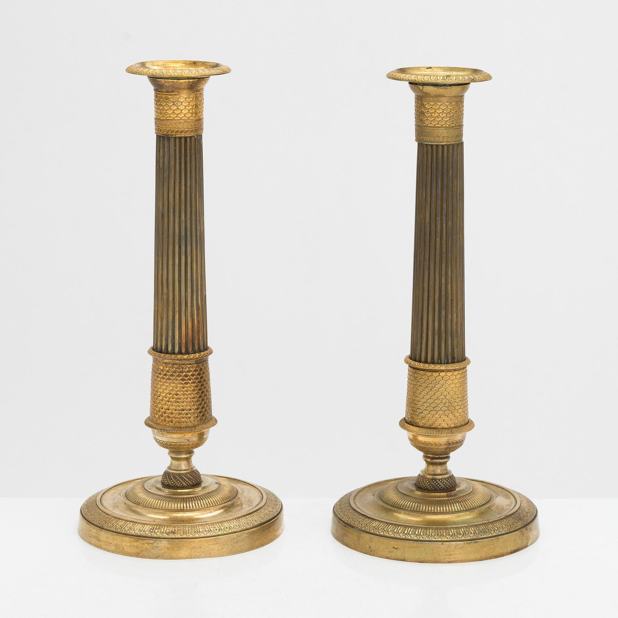 A pair of Empire style candlesticks, early 19th century.
