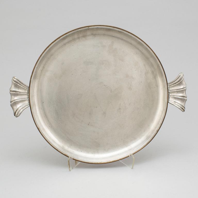 A pewter plate from Svenskt Tenn, Stockholm, 1930.