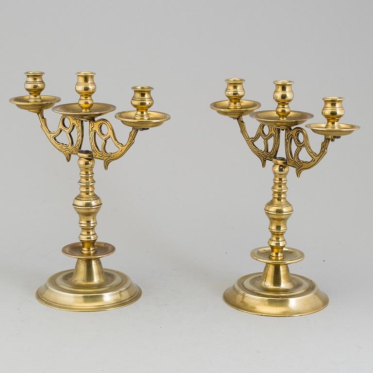 A apir of brass Baroque style candelabra, circa 1900.