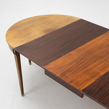 A Gustavian style mahogany dining table, 20th Century.