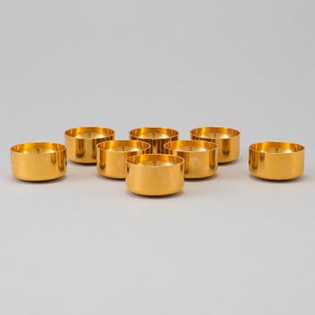 A set of eight brass drinking cups by PIERRE FORSSELL for Skultuna, Sweden.