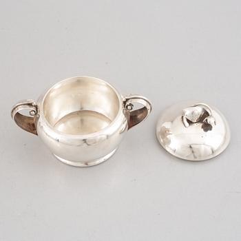 A Swedish Sterling Silver Coffee Pot, Creamer and Sugar Bowl, mark of Nordisk Silverkonst, Helsingborg 1948.