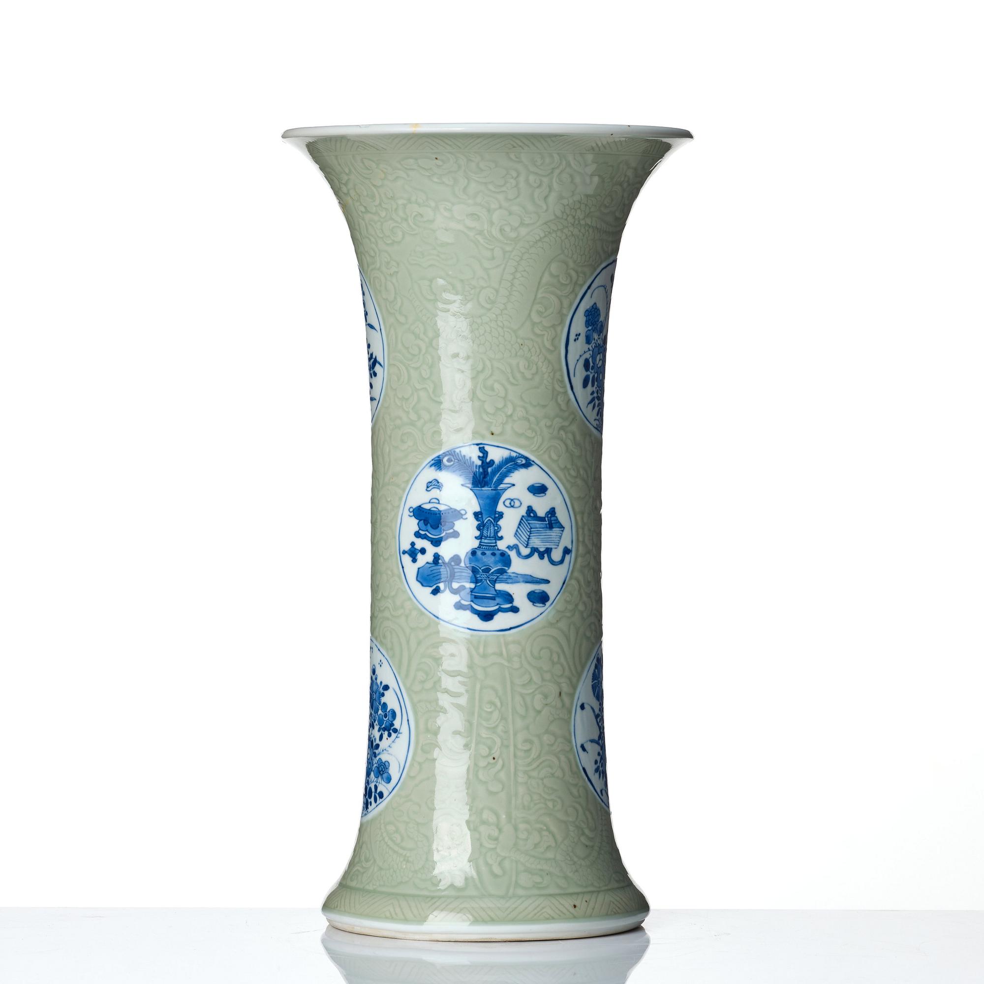 A Chinese blue and white celadon-ground beaker vase, Qing dynasty, Kangxi (1662-1722).