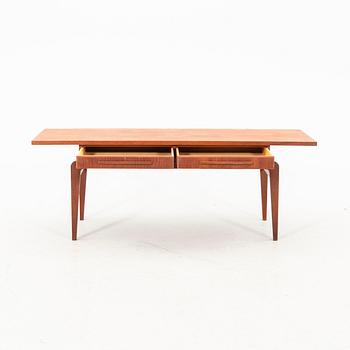 A teak coffee table from the middle of the 20th century.