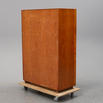 A oak cabinet from the first half of the 20th century.