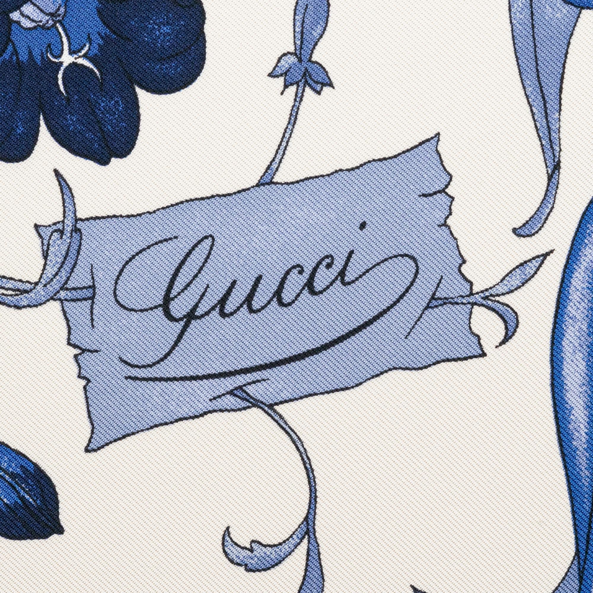 Gucci, a 'Flora' twill silk scarf.