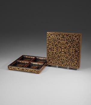 A black and gold lacquer box and cover containing a cabaret, late Qing dynasty (1644-1912).