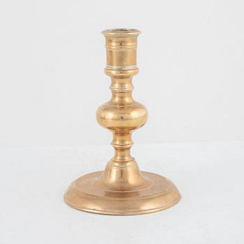 A Baroque brass candlestick, 17th century.
