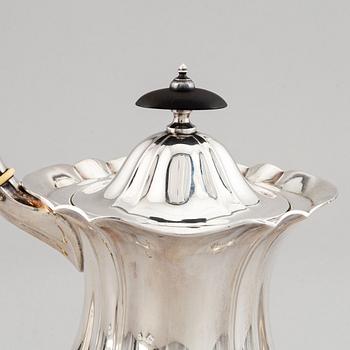 A swedish parcel-gilt coffee pot, creamer and suga bowl.