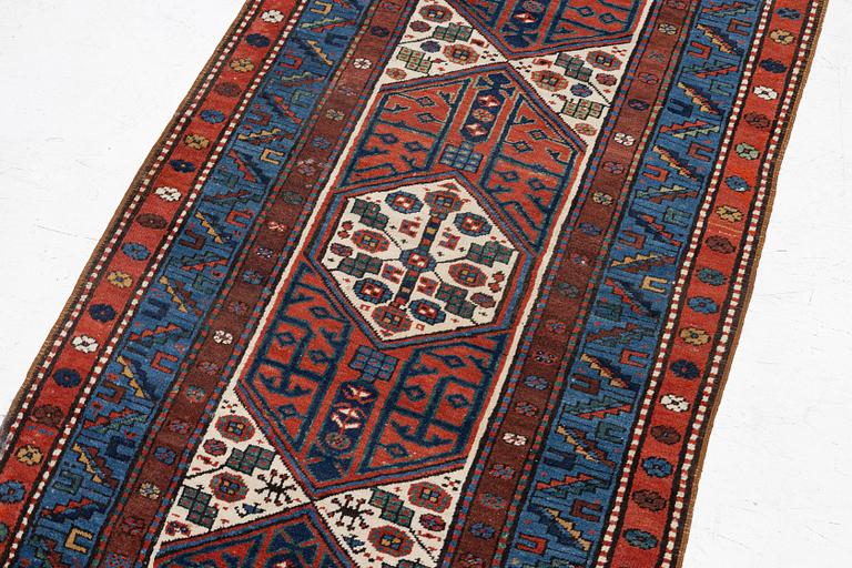 An antique Kurdish runner, probably,. 406 x 105 cm.