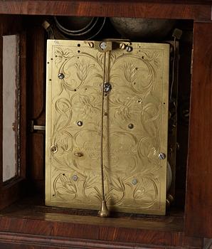 A Queen Anne early 18th century brass-mounted walnut striking table clock by Jacobeus Markwick.