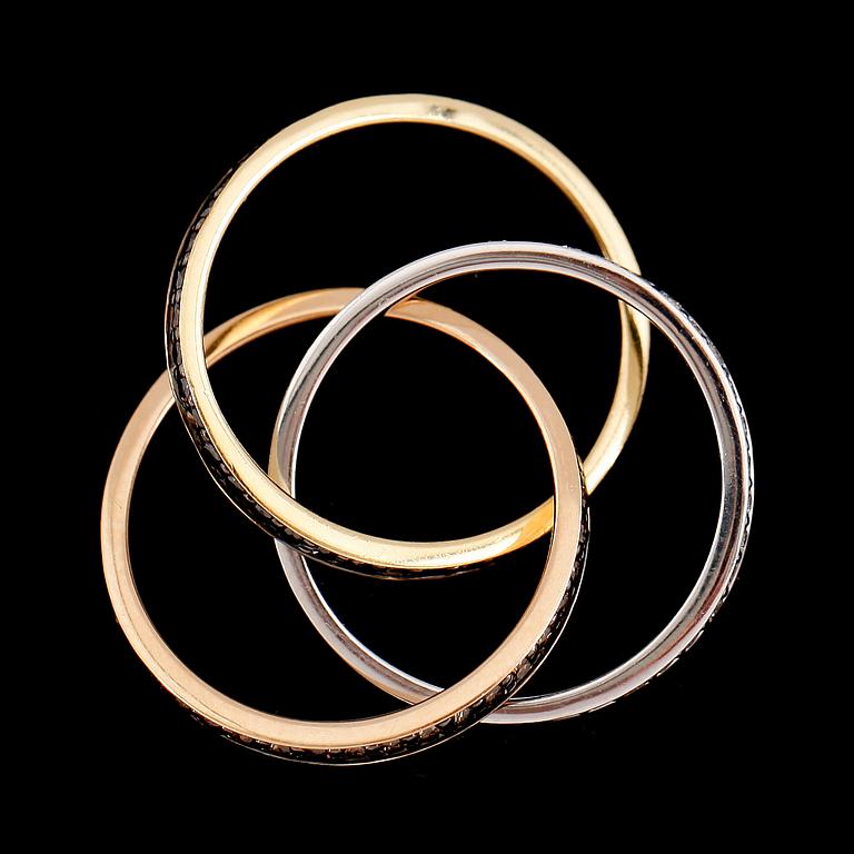 RING, tredelad, 18 k rött, vitt och roséguld, diamanter totalt 1.44 ct.
