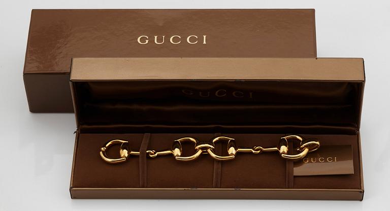 An 18K gold Gucci bracelet.