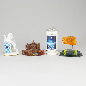 Four sculptures and a jug.