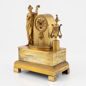 An ormolu Empire mantel clock, first part of the 19th century.