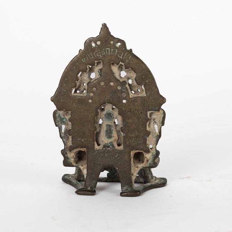 A Jain Shrine, India, copper alloy with silver inlay, 14/15th Century or older.