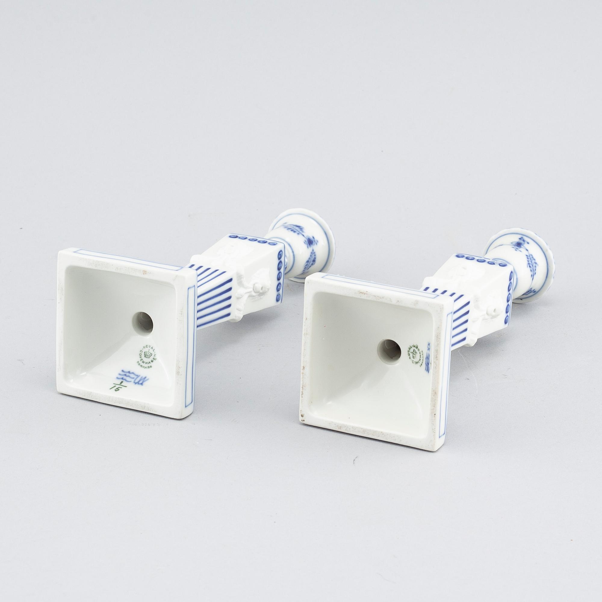 A pair of "Musselmalet" candlesticks in porcelain, by Royal Copenhagen, second half of the 20th century.