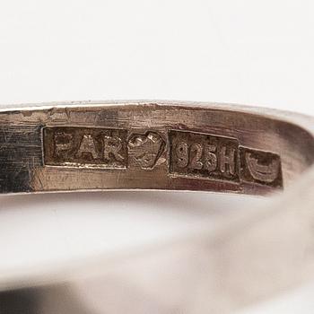 Paula Häiväoja, A sterling silver and gold ring "Taittovan kulman peilit". Pentti Roos, Helsinki.