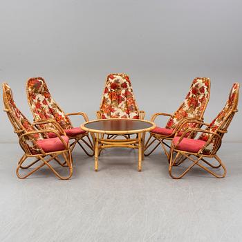 A set of 5 armchairs and a table, second half of the 20th century.