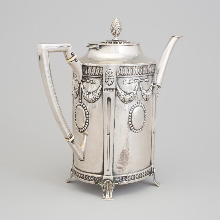 A set of three silver objects (coffeepot, creamer and sugarbowl, CG Hallberg and GAB, Stockholm 1907. Weight ca 1226 gr.