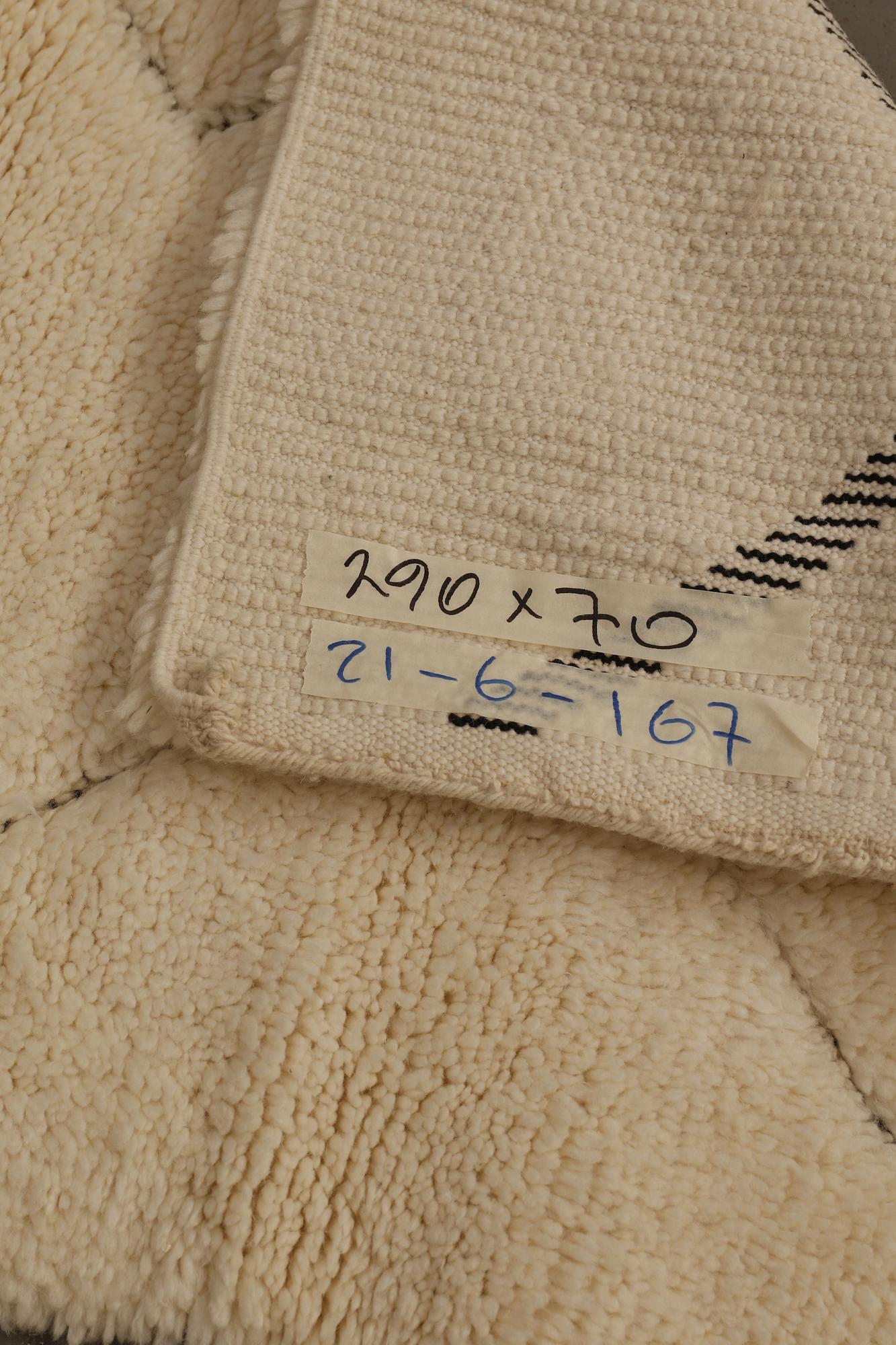 A Moroccan runner carpet, 290 x 70 cm.