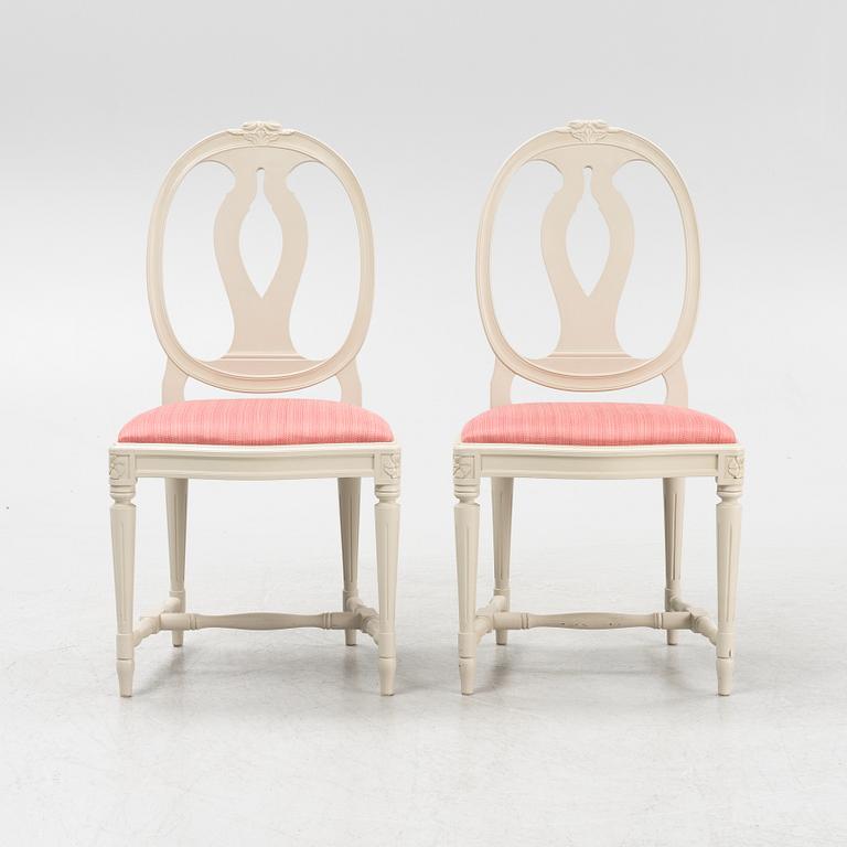 A Gustavian style table with four chairs, second half of the 20th century.