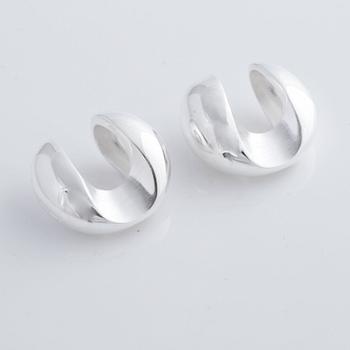 A pair of cufflink, by Ole Lynggaard.