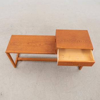 A 1970s oak bench.
