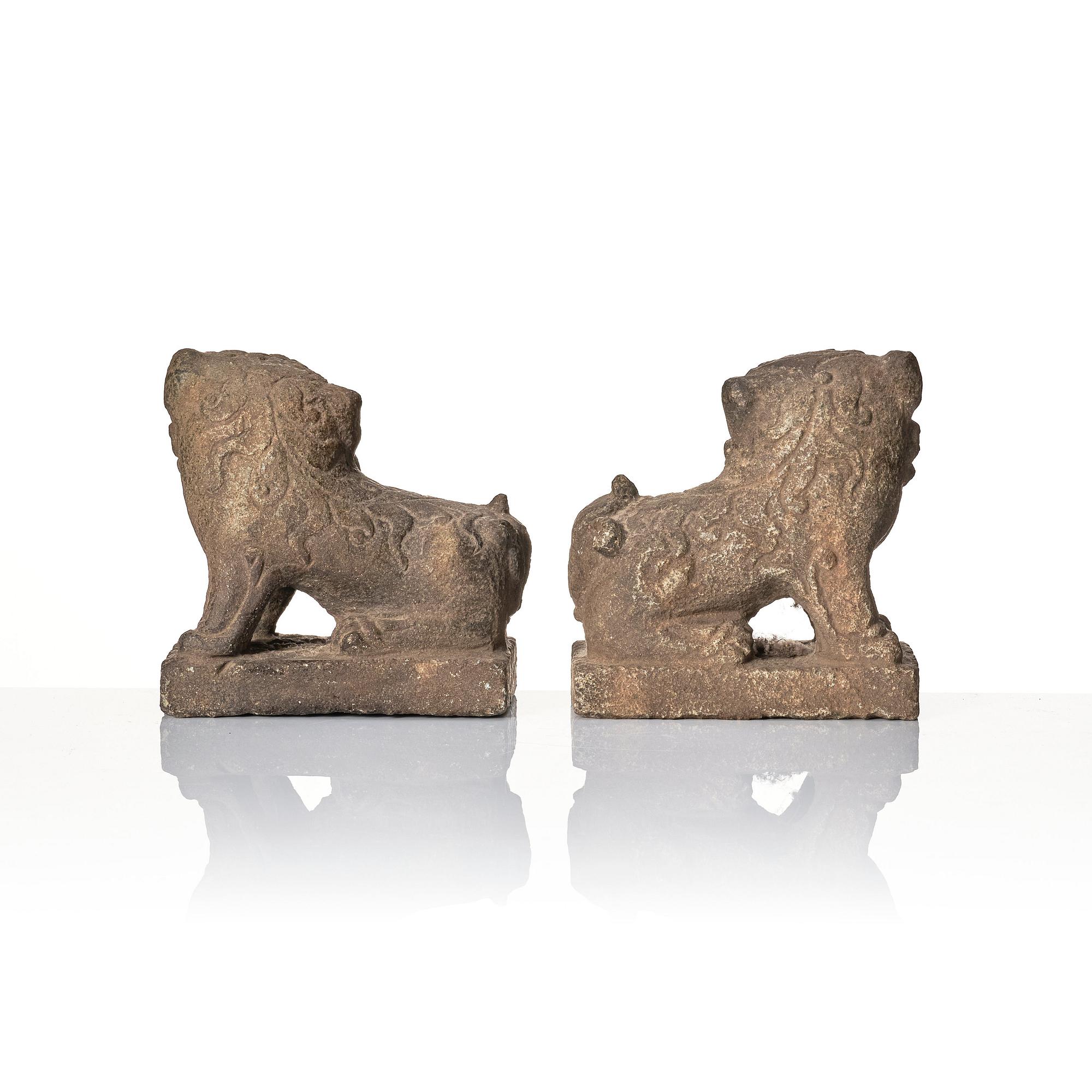 A pair of stone sculptures of buddhist lions, Qing dynasty (1664-1912).