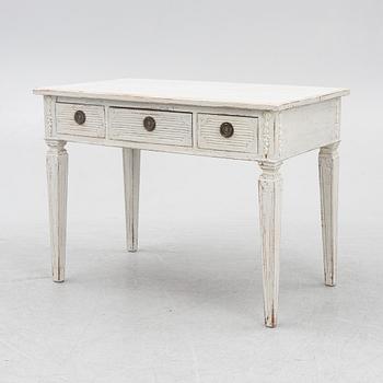 A late 19th century desk and an "Odenslunda" chair from IKEAs 18th century series.
