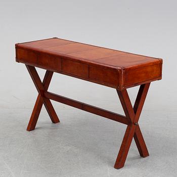 A contemporary dressing table with stool.